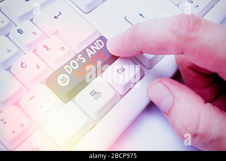 Conceptual hand writing showing Do Is And Dont Is. Concept meaning advising Rules or customs concerning some activity Stock Photo