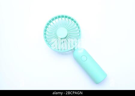 Portable rechargeable mini fans. Portable fans that can be easily carried everywhere. Close-up of tosca portable fans. Stock Photo