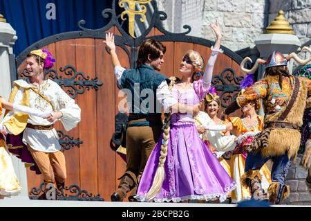 Live Disney show in front of the Castle in the Magic Kingdom theme park at Disney World, featuring Minnie and Mickey Mouse, Elsa, Anna and Olaf etc Stock Photo