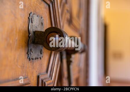 Old finish line lock, on a wooden door. Stock Photo