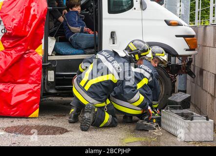 firefighters, paramedics and Italian red cross in action during a road accident simulation with cars, train and trucks, Trentino Alto Adige, northern Stock Photo