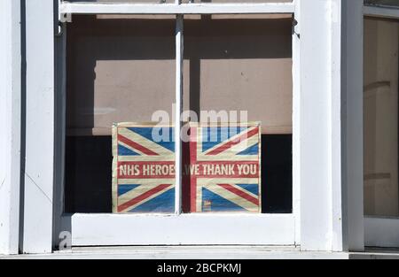 Brighton UK 5th April 2020 - A message of thanks to NHS Heroes in Brighton on a warm sunny day with temperatures expected to reach twenty degrees in London during the Coronavirus COVID-19 pandemic crisis . Health Secretary Matt Hancock has said today that they might have to revue the rules on exercising as too many people are ignoring the guidelines . Credit: Simon Dack / Alamy Live News Stock Photo