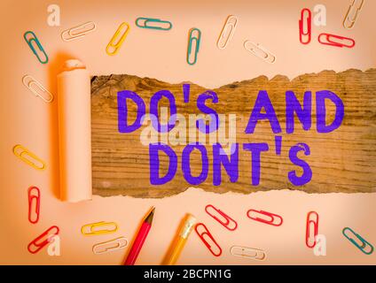Conceptual hand writing showing Do Is And Dont Is. Concept meaning advising Rules or customs concerning some activity Stock Photo