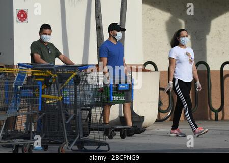 COCONUT CREEK, FL - APRIL 04: Shoppers stock up as Walmart on Saturday began limiting the number of customers who can be in it's stores at once due to the Coronavirus (COVID-19) pandemic on April 4, 2020 in Coconut Creek, Florida. Credit: mpi04/MediaPunch Stock Photo