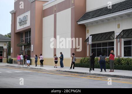 COCONUT CREEK, FL - APRIL 04: Shoppers line up outside Joann Fabrics and Crafts to get material to make masks due to the Coronavirus (COVID-19) pandemic on April 4, 2020 in Coconut Creek, Florida. Credit: mpi04/MediaPunch Stock Photo