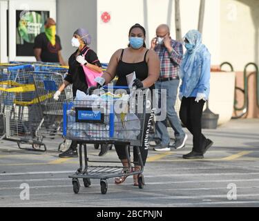 COCONUT CREEK, FL - APRIL 04: Shoppers stock up as Walmart on Saturday began limiting the number of customers who can be in it's stores at once due to the Coronavirus (COVID-19) pandemic on April 4, 2020 in Coconut Creek, Florida Credit: mpi04/MediaPunch Stock Photo