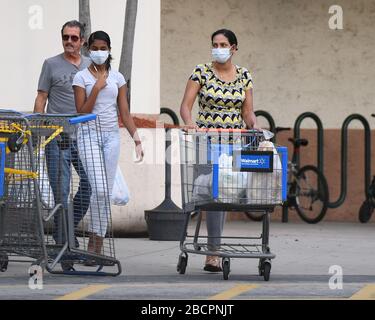 COCONUT CREEK, FL - APRIL 04: Shoppers stock up as Walmart on Saturday began limiting the number of customers who can be in it's stores at once due to the Coronavirus (COVID-19) pandemic on April 4, 2020 in Coconut Creek, Florida Credit: mpi04/MediaPunch Stock Photo