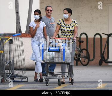 COCONUT CREEK, FL - APRIL 04: Shoppers stock up as Walmart on Saturday began limiting the number of customers who can be in it's stores at once due to the Coronavirus (COVID-19) pandemic on April 4, 2020 in Coconut Creek, Florida Credit: mpi04/MediaPunch Stock Photo