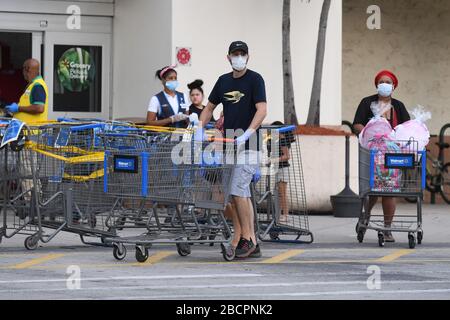 COCONUT CREEK, FL - APRIL 04: Shoppers stock up as Walmart on Saturday began limiting the number of customers who can be in it's stores at once due to the Coronavirus (COVID-19) pandemic on April 4, 2020 in Coconut Creek, Florida Credit: mpi04/MediaPunch Stock Photo