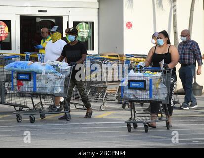 COCONUT CREEK, FL - APRIL 04: Shoppers stock up as Walmart on Saturday began limiting the number of customers who can be in it's stores at once due to the Coronavirus (COVID-19) pandemic on April 4, 2020 in Coconut Creek, Florida Credit: mpi04/MediaPunch Stock Photo