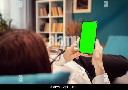 Female using smartphone, chromakey Stock Photo