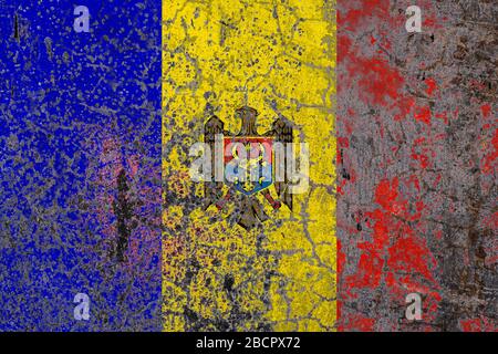 National flag of Moldova on old peeling wall background.The concept of national pride and symbol of the country. Stock Photo