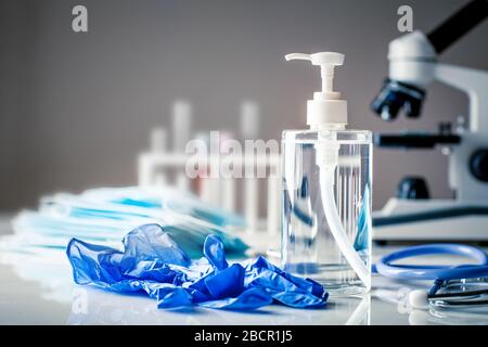 Protective medical masks and disinfectant gel. Protective measures against coronavirus, viruses and bacteria. Background with copy space. Stock Photo