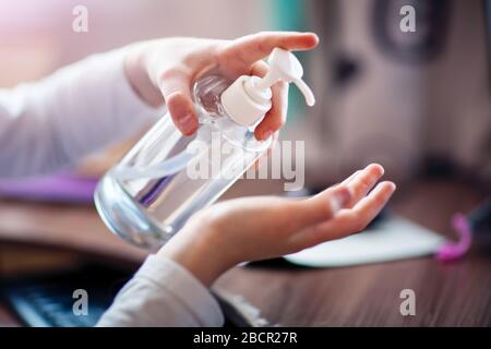 The child disinfects their hands with a disinfectant. New Epidemic Coronavirus 2019 nCoV. Selective focus. Stock Photo