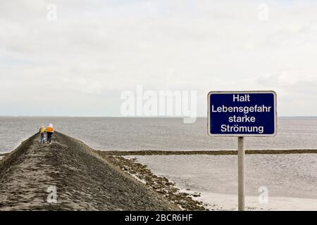 Danger to life and risk of flooding at the Butjardingen dyke in Lower Saxony, Germany. Stock Photo