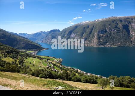 Aurlandsfjord fjord in Sogn og Fjordane county with mountain village Aurlandsvangen. Norway. Seen from route E16 and the Stegastein viewpoint Stock Photo