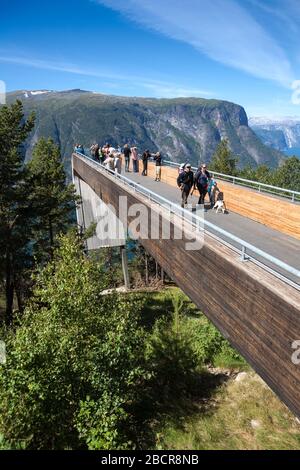 NORWAY-CIRCA JUL, 2018: People look Aurlandsfjord landscape from Stegastein viewing platform. It is located on national tourist route Aurlandsfjellet. Stock Photo