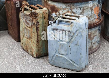 Old rusty German jerrycans for drinking water and gasoline from WWII period Stock Photo