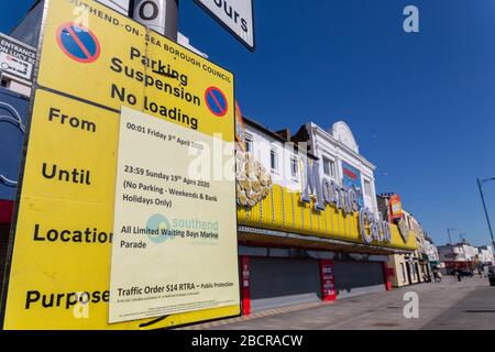 Southend-on-Sea, UK. 5th Apr, 2020. A yellow Southend-on-Sea Borough Council sign announces temporary parking suspension and no loading restrictions on Marine Parade from 9–19 April 2020, as part of public protection measures under the COVID-19 pandemic. The seafront appears unusually empty, with social distancing in effect and leisure venues closed or quiet. The Monte Carlo amusement arcade stands in the background, contrasting with the deserted promenade and restricted parking bays. Penelope Barritt/Alamy Live News Stock Photo