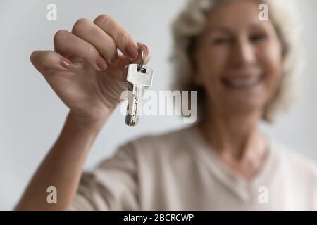 Head shot close up focus on keys from new apartment. Stock Photo