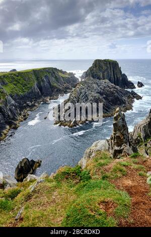 The view of cliff near Malin Head, in County Donegal, Ireland. This point is in western position respect to Malin Head. Stock Photo