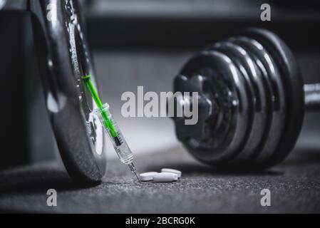 Syringe and stethoscope on a metal surface Stock Photo