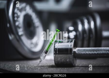 Syringe and stethoscope on a metal surface. Doping in gym Stock Photo