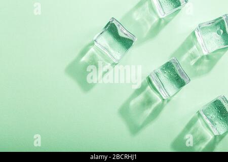 Colored banner with fresh ice cubes and reflections Stock Photo