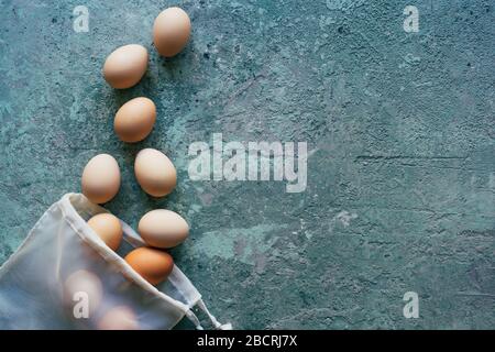 Eggs scattered from a textile shopping bag. Stock Photo
