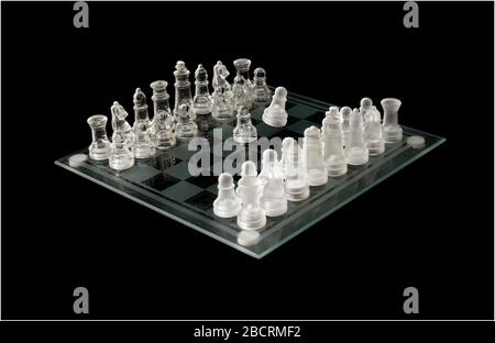 glass chess set with pieces in play Stock Photo