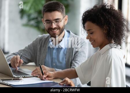 Close up african american businesswoman signing partnership agreement concept. Stock Photo