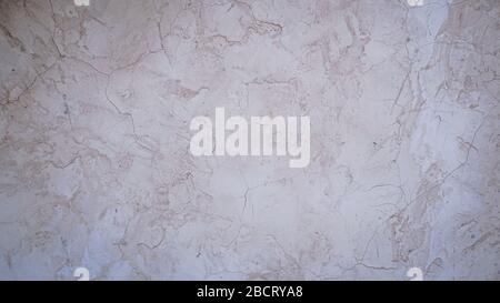 White polished plaster. Plaster and Wall finishes. Polished Plaster - Suede with large open pearl pattern. Stock Photo