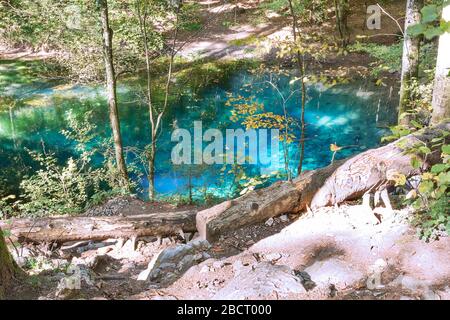 natural blue coloured wellspring lake in Cheile Nerei, Ochiul Bei, Caransebes, Romania