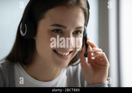 Female employee in headset consult client online Stock Photo