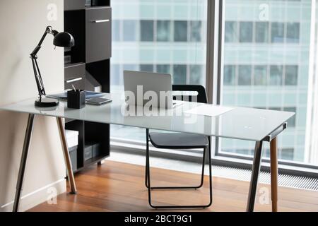 Office desk with modern laptop and paperwork on it Stock Photo