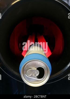 Close up of alcoholic drink can in automatic reverse vending machine for collecting and recycling empty bottles and cans Stock Photo