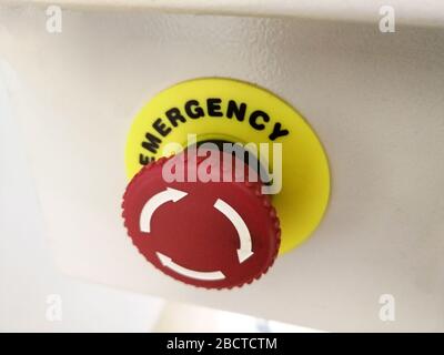 Red button on industrial machine for cancel and emergency stop of production line Stock Photo