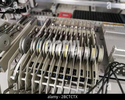 Mechanisms inside pick and place machine for electronics printed circuit board assembling Stock Photo