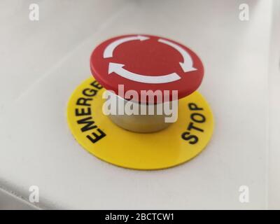Red button on industrial machine for cancel and emergency stop of production line Stock Photo
