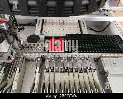 Mechanisms inside pick and place machine for electronics printed circuit board assembling Stock Photo