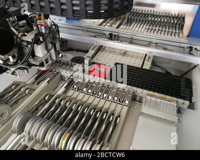 Mechanisms inside pick and place machine for electronics printed circuit board assembling Stock Photo