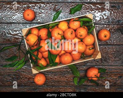 Top view angle of mandarin oranges case on table Stock Photo