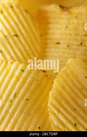 Wavy potato chips abstract texture pattern macro close up Stock Photo