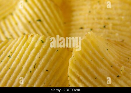 Wavy potato chips abstract texture pattern macro close up Stock Photo