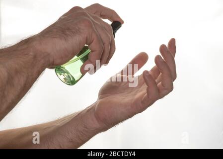 Man uses alcoholic hand sanitizer gel. Prevention from coronavirus to other infectious diseases. Hygiene concept Stock Photo