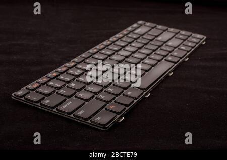 The replacement of laptop keyboard  isolated on the dark background Stock Photo