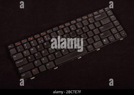 The replacement of laptop keyboard  isolated on the dark background Stock Photo