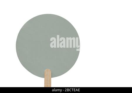 round grey wooden plate on a wooden stick with copy space. isolated. banner for advertising Stock Photo