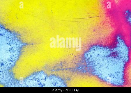 abstract background. yellow-red paint polished to a metal base Stock Photo