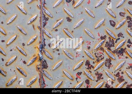 pattern metal floor. scratched shabby rusty metal. gray color. industrial abstraction Stock Photo